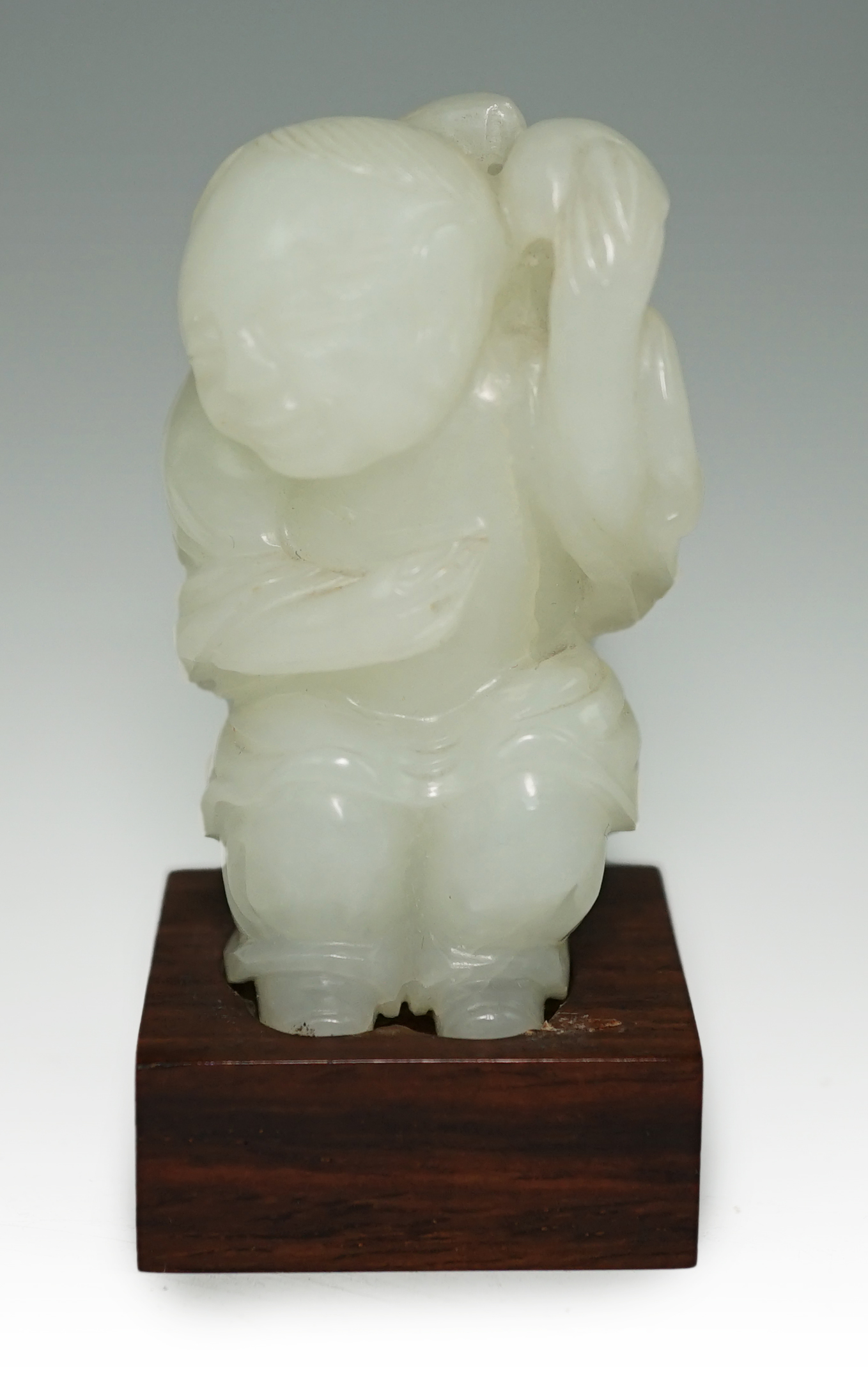 A Chinese white jade figure of Liu Hai, 18th-19th century